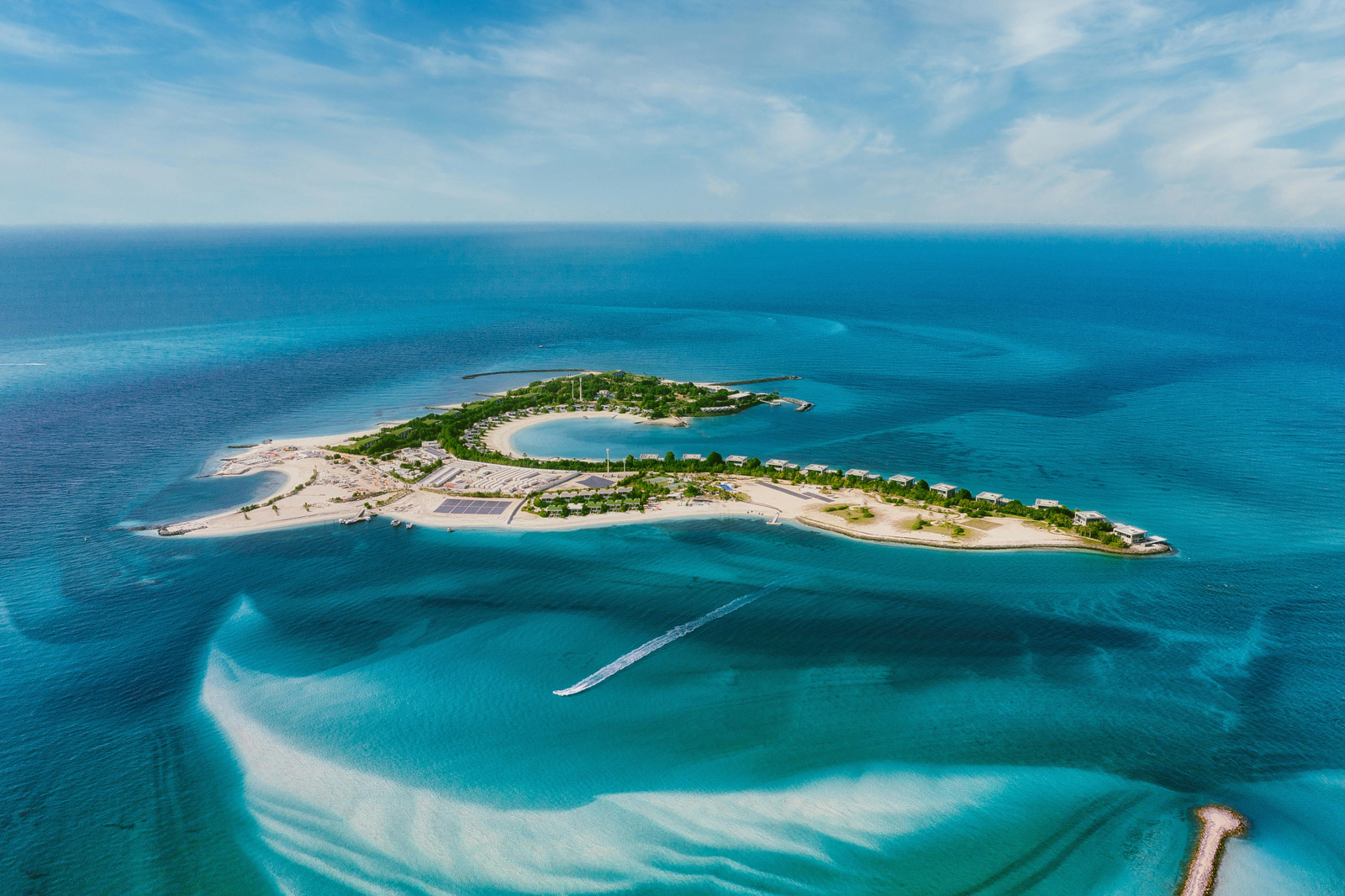 Aerial view of Sir Bani Yas Island showing trees, buildings, roads, and wildlife habitat