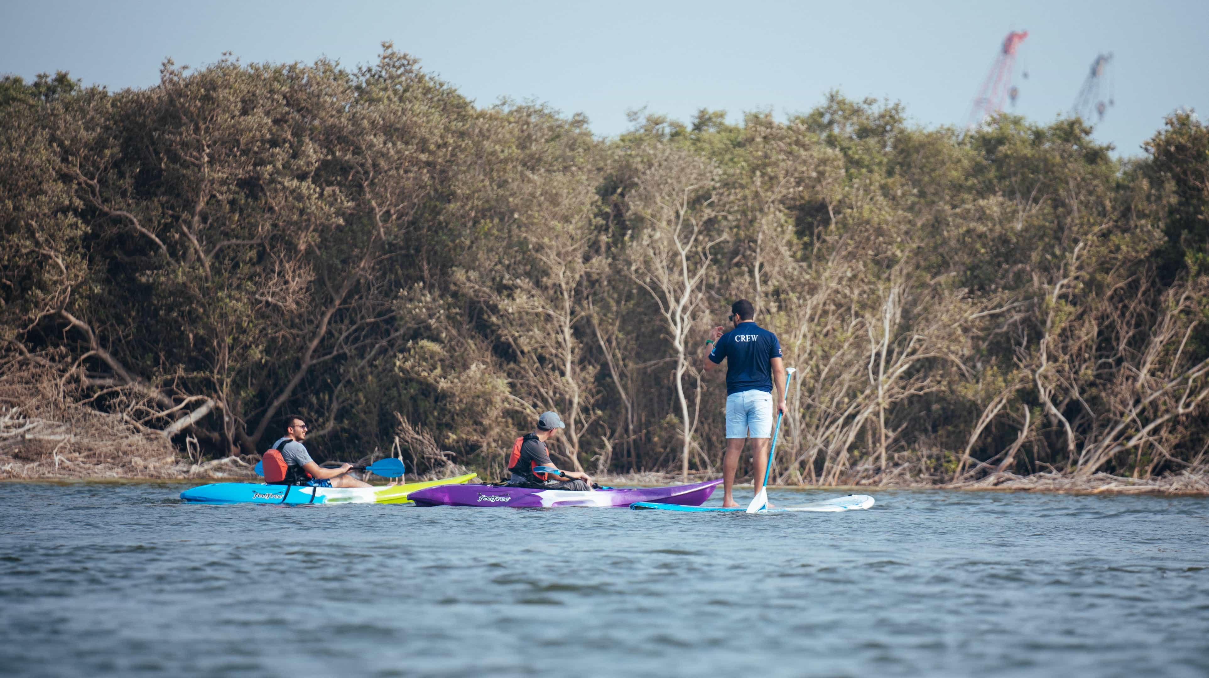 Three people kayaking in Abu Dhabi 