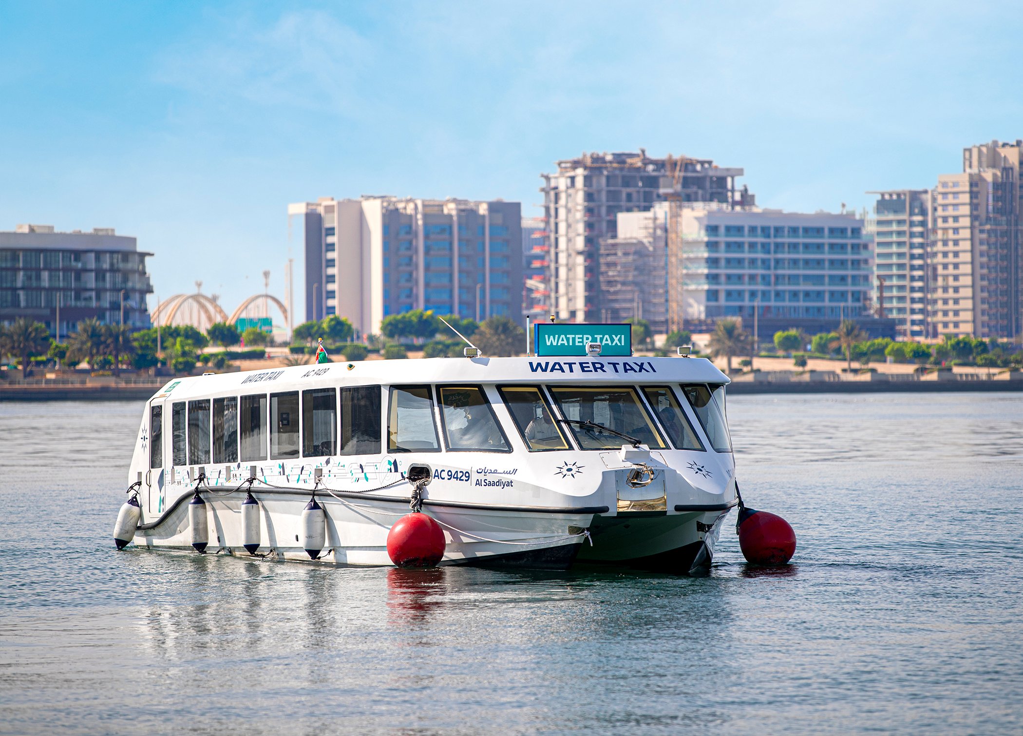 Al Saadiyat Water Taxi with buildings in the background