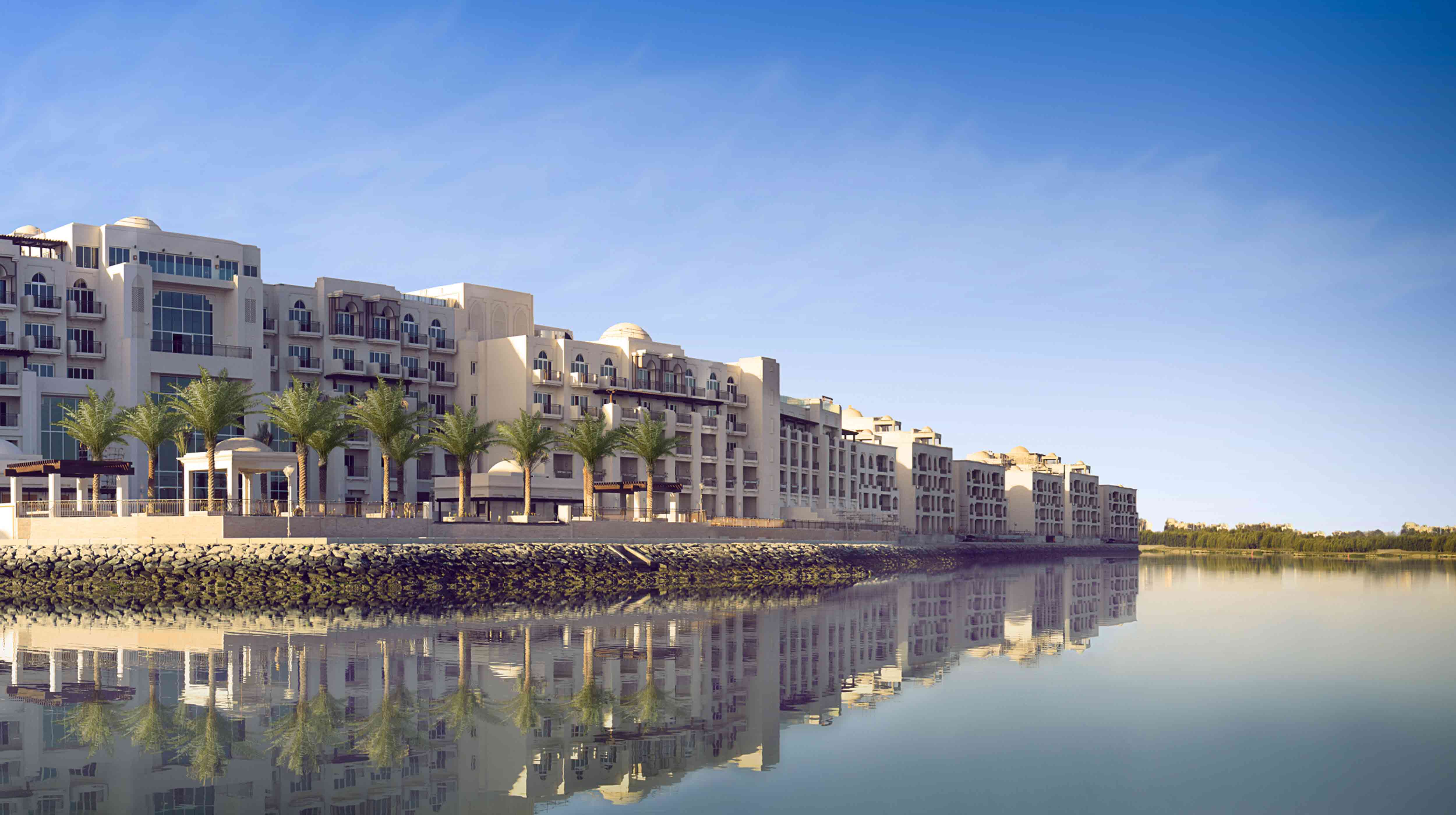 Beautiful white buildings across the waters in Eastern Mangroves Marina