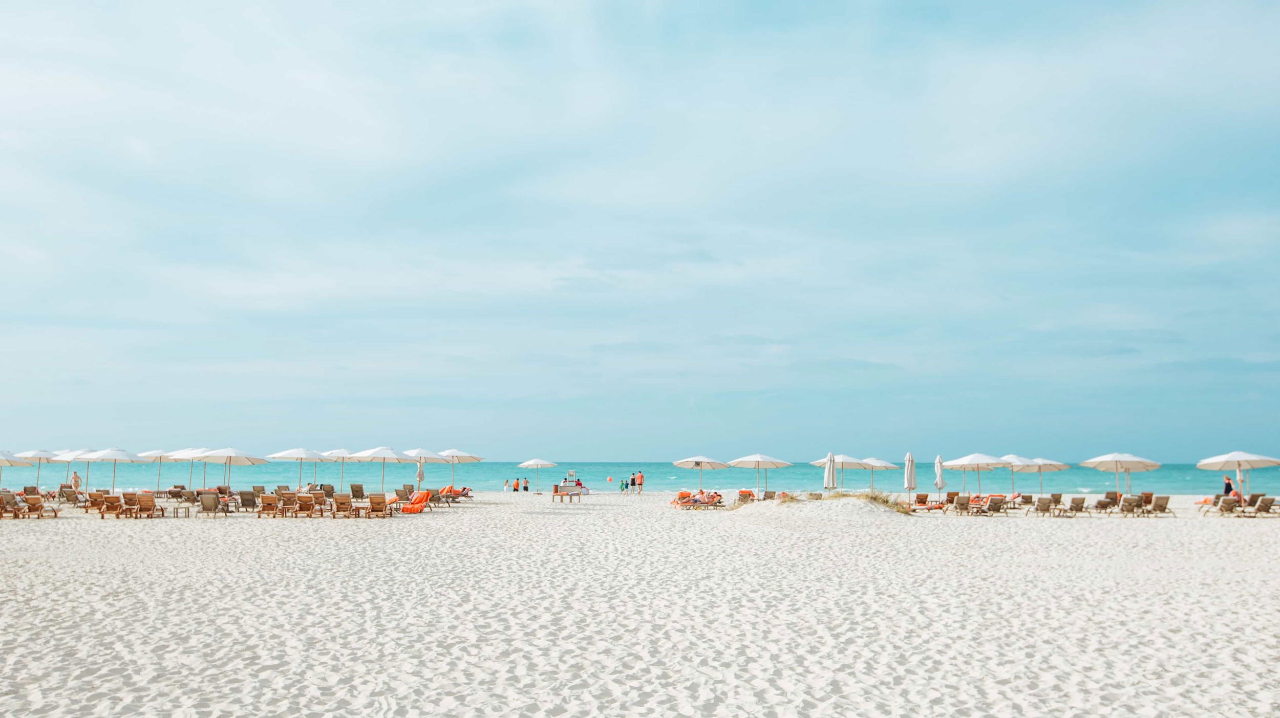 View of the waters and sunbeds at Saadiyat Beach