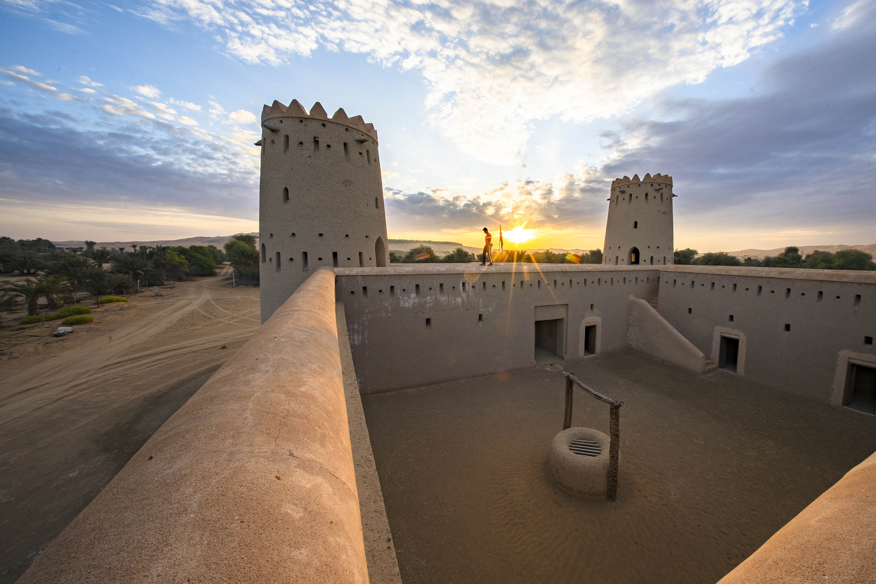 Man walking on the wall in one of the forts in Abu Dhabi Emirate