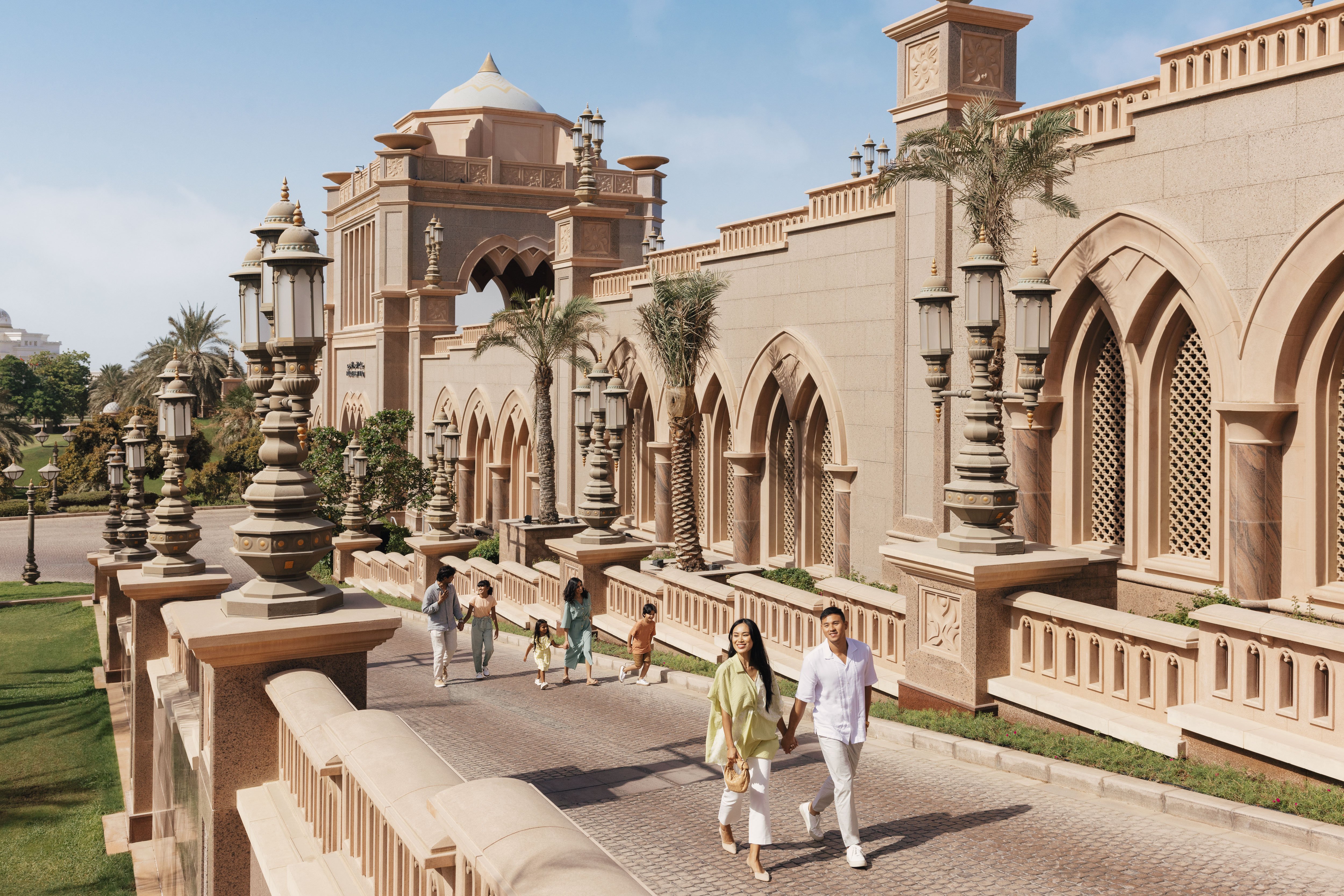 Families walking in the plazas outside Emirates Palace