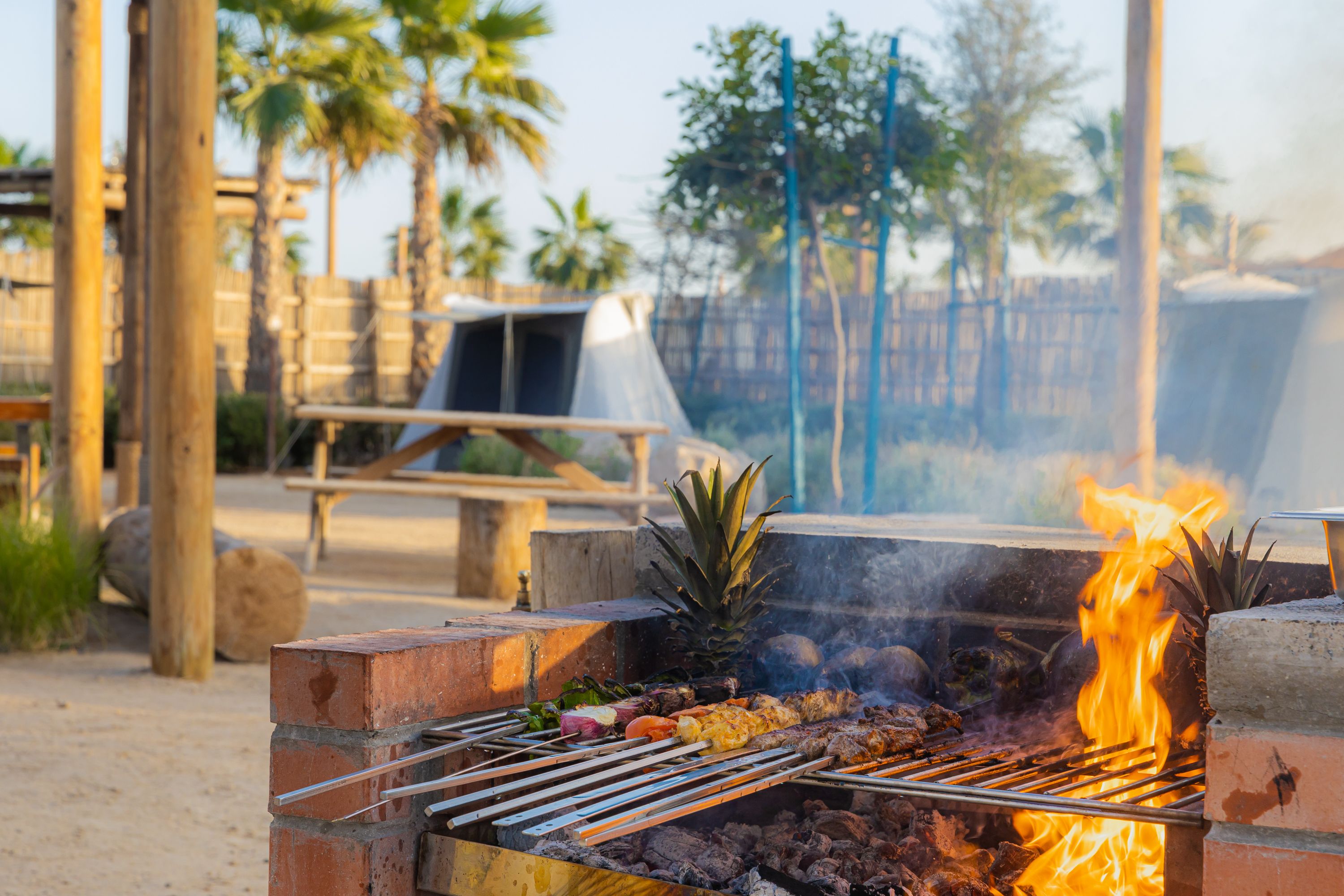 Food cooking on a barbecue in a camp on Hudayriyat Island