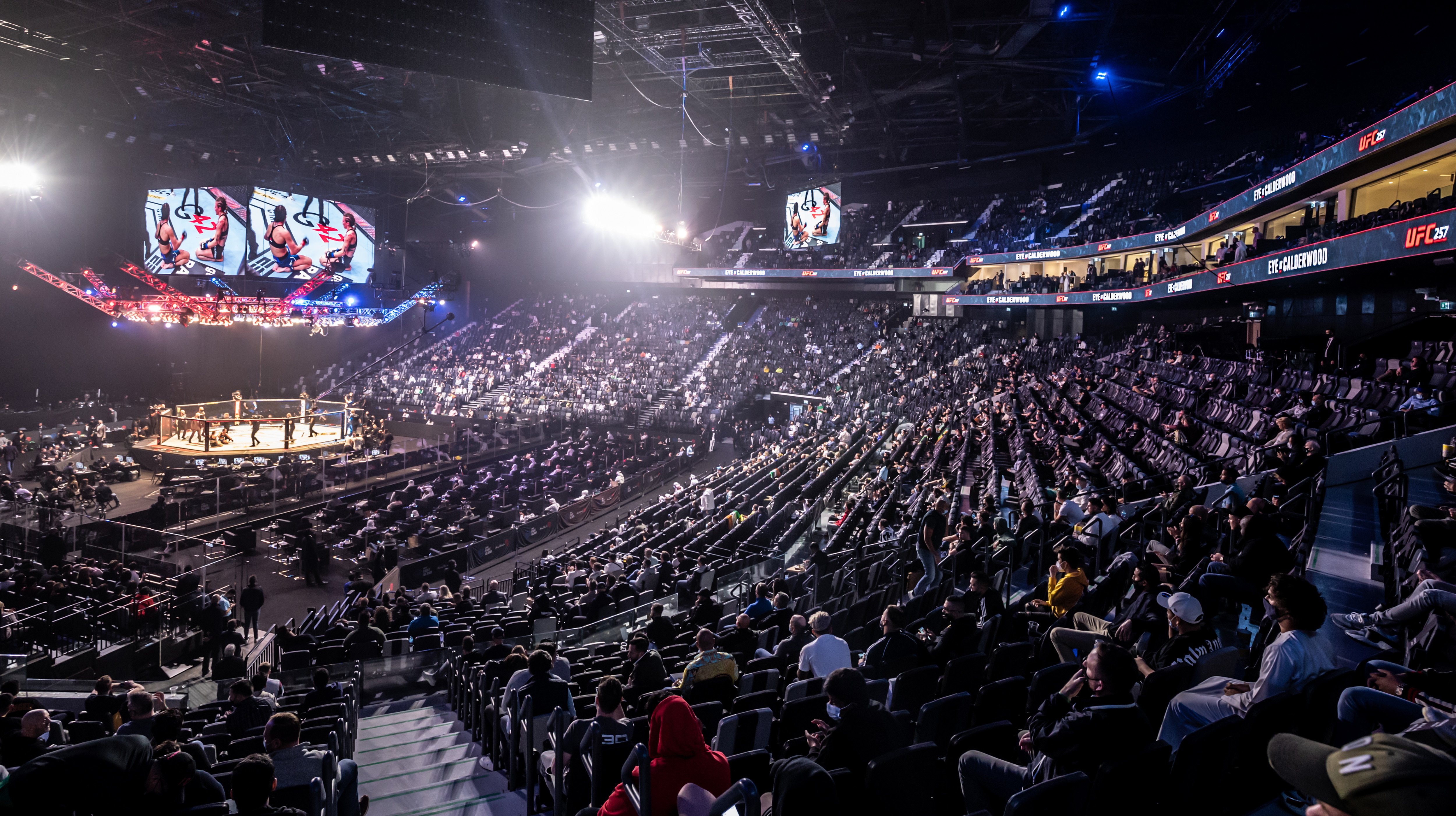 Spectators watching a wrestling match at Etihad Arena