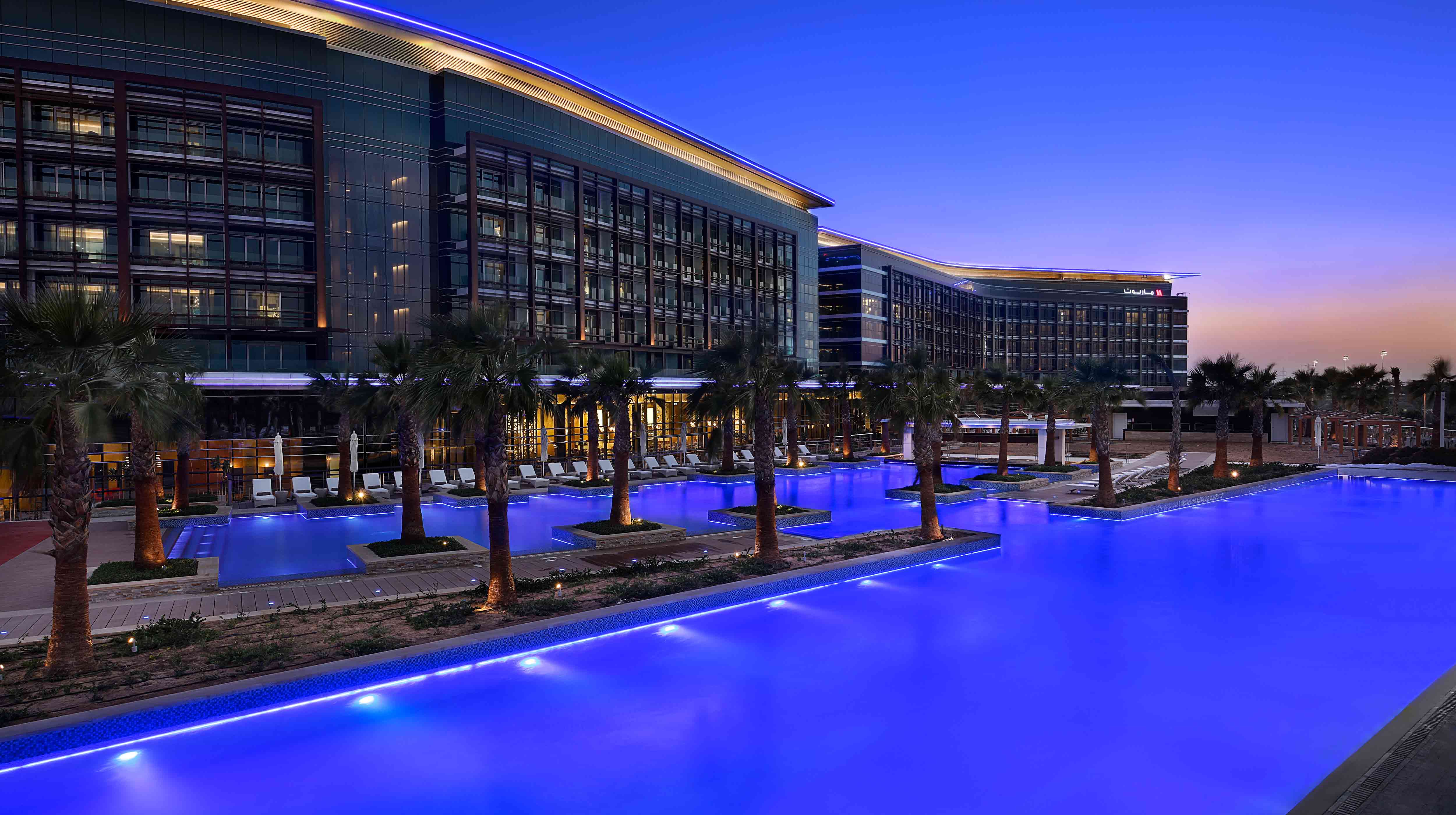 Exterior of Al Forsan International Sports Resort at dusk